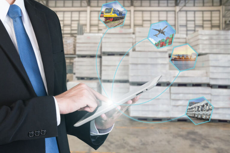 Logistic concept with businessman hand holding digital tablet shipping icons use for import, export and logistic background.
